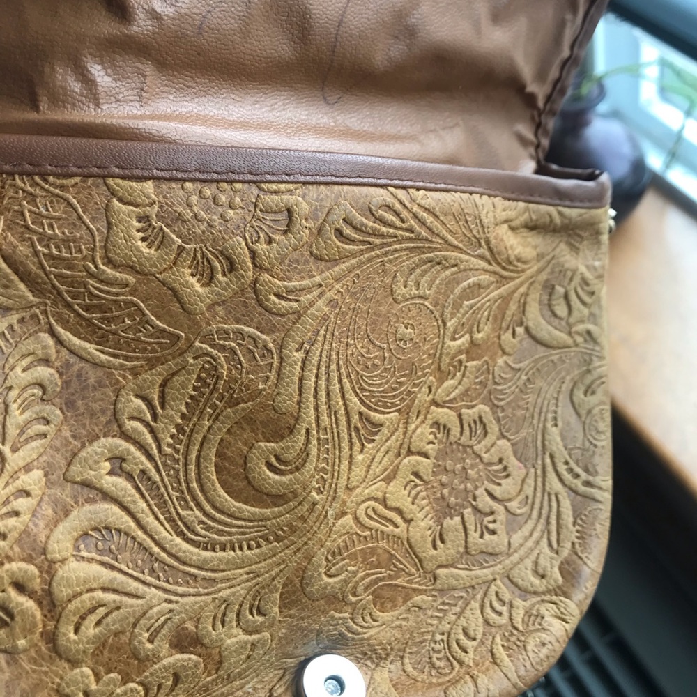 Italian leather chain purse . Detailed leather paisley like designs.